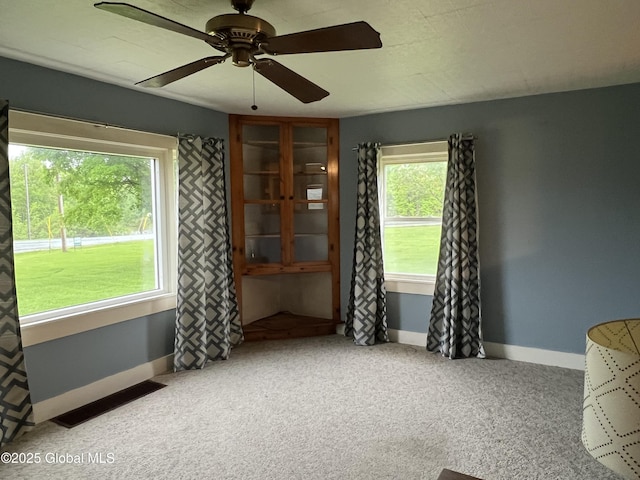3778 County Rte 21, Whitehall, NY 12887 - carpeted spare room with baseboards and a ceiling fan