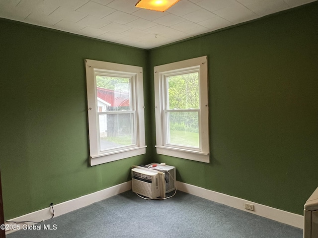3778 County Rte 21, Whitehall, NY 12887 - carpeted empty room with baseboards and a wall mounted air conditioner