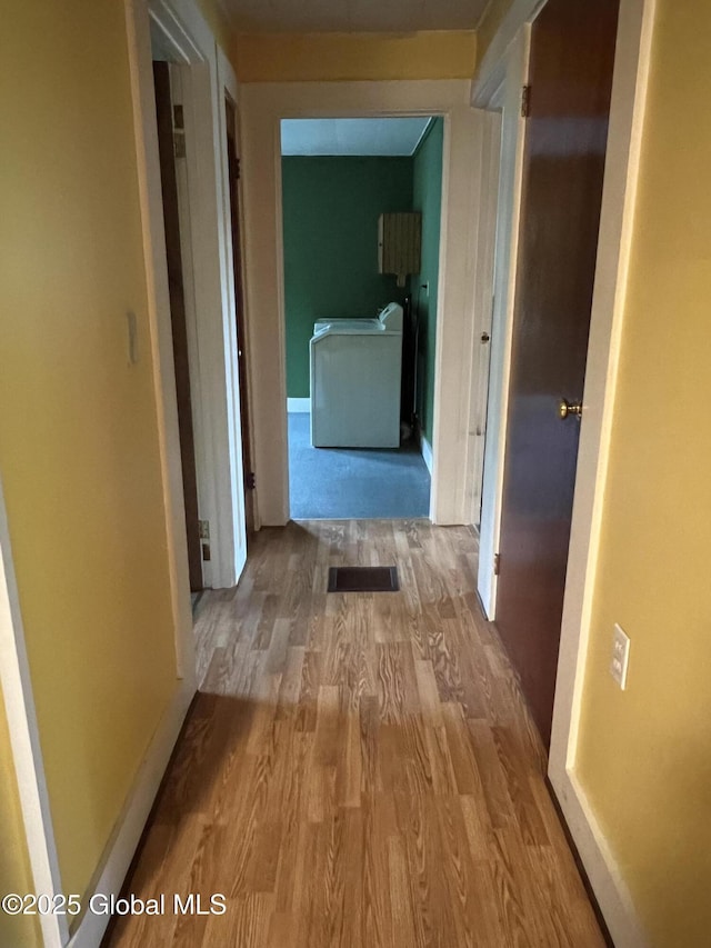3778 County Rte 21, Whitehall, NY 12887 - hallway with washer / dryer and wood finished floors