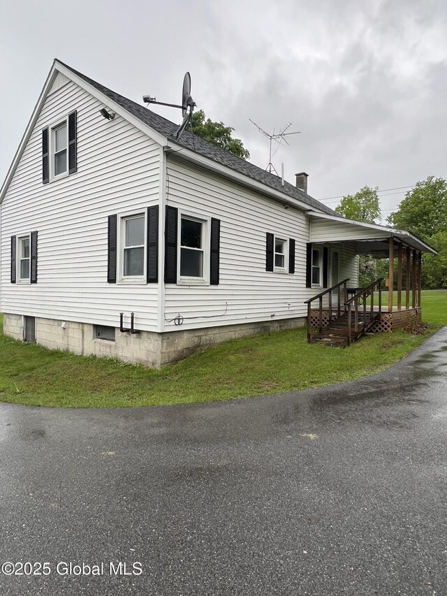 3778 County Rte 21, Whitehall, NY 12887 - view of property exterior featuring a chimney, a shingled roof, a porch, and a yard