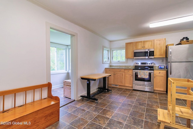 773 Charlton Rd, Charlton, NY 12019 - kitchen featuring appliances with stainless steel finishes, ornamental molding, light countertops, light brown cabinets, and dark stone finish floors