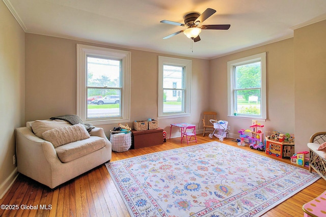 773 Charlton Rd, Charlton, NY 12019 - rec room with hardwood / wood-style flooring, a ceiling fan, and ornamental molding