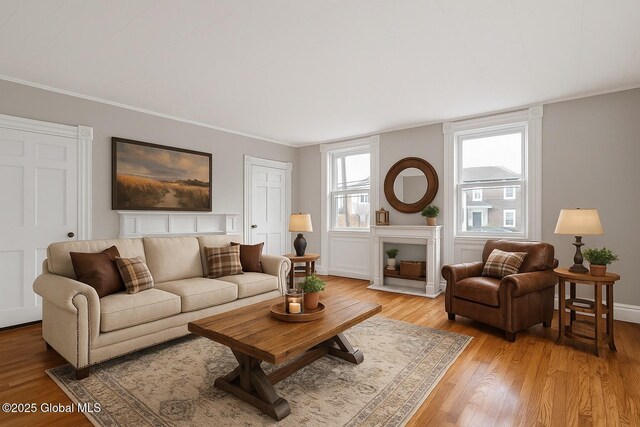 2127 2nd Ave, Watervliet, NY 12189 - living room with light wood-style flooring, crown molding, and baseboards