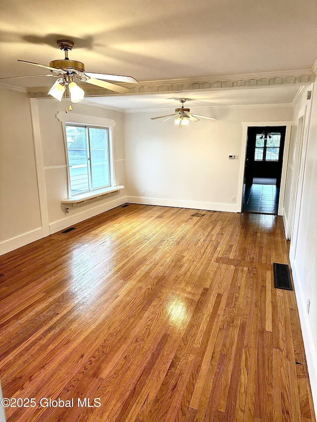 2618 Stanton St, Rotterdam, NY 12306 - spare room with a ceiling fan, wood finished floors, crown molding, and baseboards