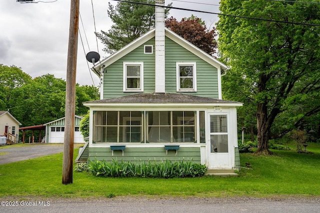 1038 Vly Summit Rd, Cambridge, NY 12834 - view of front of home with a sunroom, an outbuilding, a garage, and a front yard