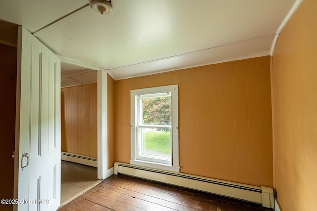 1038 Vly Summit Rd, Cambridge, NY 12834 - unfurnished room with baseboard heating, hardwood / wood-style floors, and wood walls