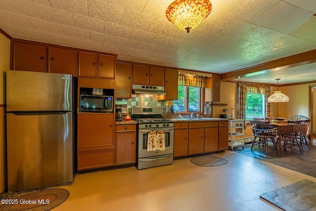 1038 Vly Summit Rd, Cambridge, NY 12834 - kitchen featuring stainless steel appliances, under cabinet range hood, brown cabinetry, a sink, and ornamental molding