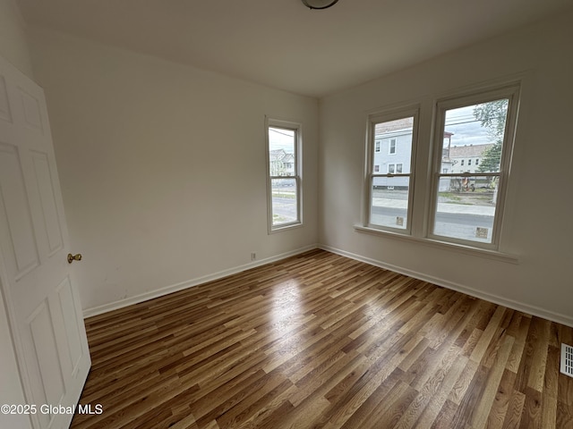 1 Swan St, Schenectady, NY 12307 - spare room with dark wood finished floors and baseboards