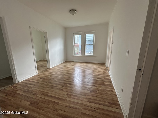 1 Swan St, Schenectady, NY 12307 - unfurnished room featuring wood finished floors and baseboards