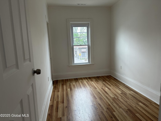 1 Swan St, Schenectady, NY 12307 - unfurnished room featuring wood finished floors, baseboards, and ornamental molding