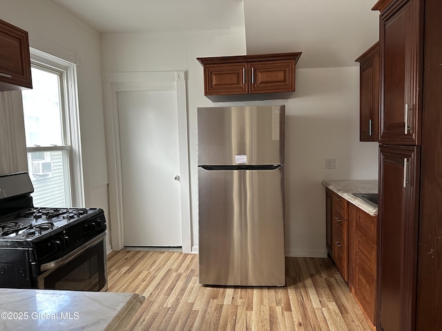1 Swan St, Schenectady, NY 12307 - kitchen with stainless steel appliances, light wood-type flooring, and light countertops