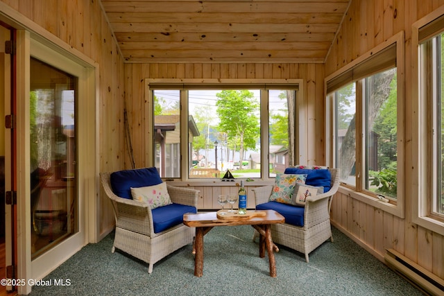 38 N Island Rd, Bolton, NY 12814 - sunroom with a baseboard radiator, vaulted ceiling, wood walls, carpet, and healthy amount of natural light