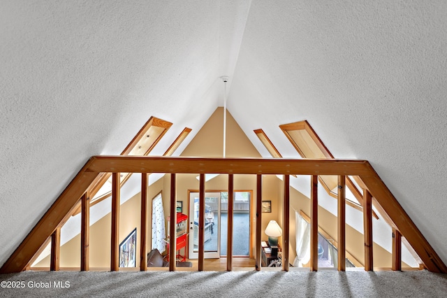 38 N Island Rd, Bolton, NY 12814 - stairway featuring vaulted ceiling, a textured wall, and a textured ceiling