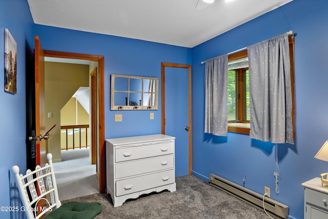 38 N Island Rd, Bolton, NY 12814 - bedroom featuring a baseboard radiator, carpet, and baseboards