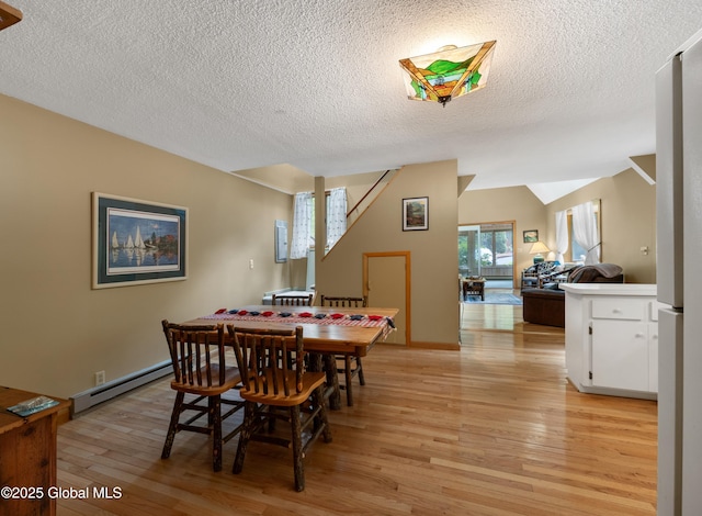 38 N Island Rd, Bolton, NY 12814 - dining space with a baseboard radiator, light wood-style floors, a textured ceiling, and stairs