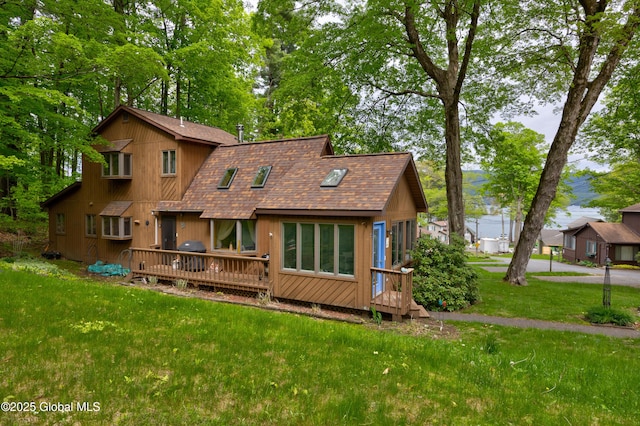 38 N Island Rd, Bolton, NY 12814 - back of house with roof with shingles, a wooden deck, and a yard