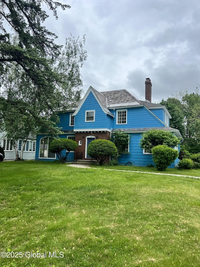 194 S Main Ave, Albany, NY 12208 - view of front of home featuring a chimney and a front yard