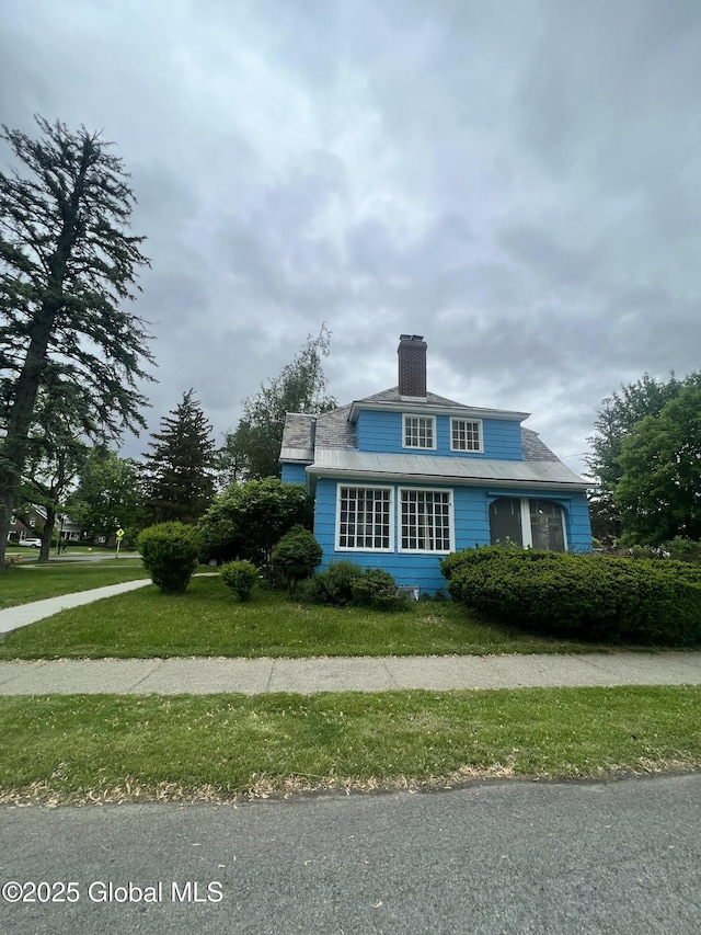 194 S Main Ave, Albany, NY 12208 - view of front of home featuring a chimney and a front yard
