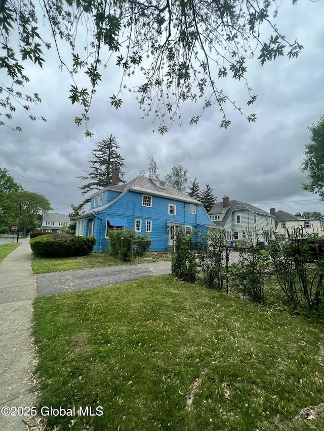 194 S Main Ave, Albany, NY 12208 - exterior space with a yard and a chimney