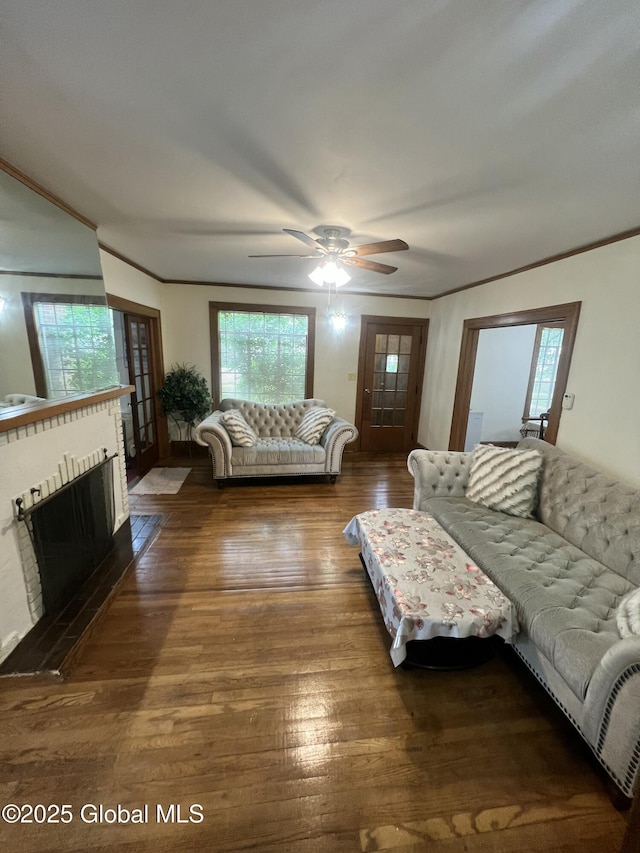 194 S Main Ave, Albany, NY 12208 - living room featuring hardwood / wood-style floors, ornamental molding, a ceiling fan, and a brick fireplace