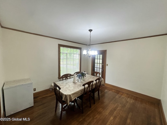 194 S Main Ave, Albany, NY 12208 - dining room featuring baseboards, dark wood-type flooring, ornamental molding, and a chandelier