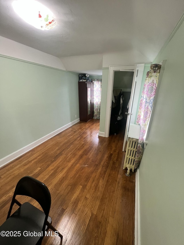 194 S Main Ave, Albany, NY 12208 - unfurnished room featuring wood finished floors, baseboards, and vaulted ceiling