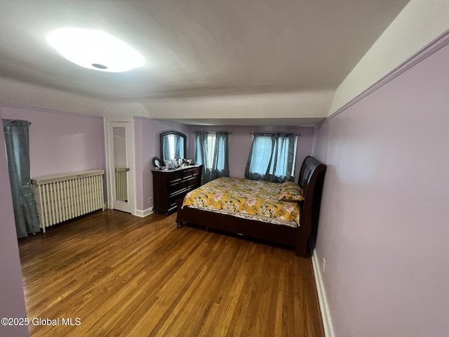 194 S Main Ave, Albany, NY 12208 - bedroom with radiator heating unit, wood finished floors, and baseboards
