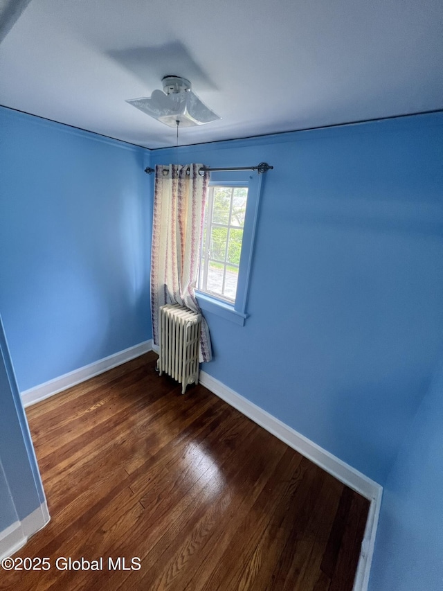 194 S Main Ave, Albany, NY 12208 - empty room featuring radiator heating unit, ceiling fan, baseboards, and wood finished floors