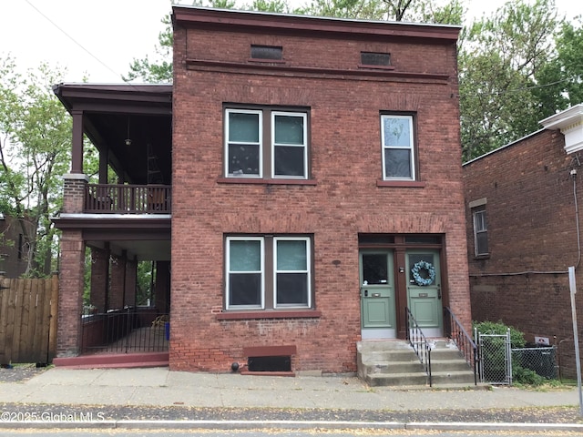 281 10th St, Troy, NY 12180 - view of front of property with brick siding, entry steps, a gate, and a balcony