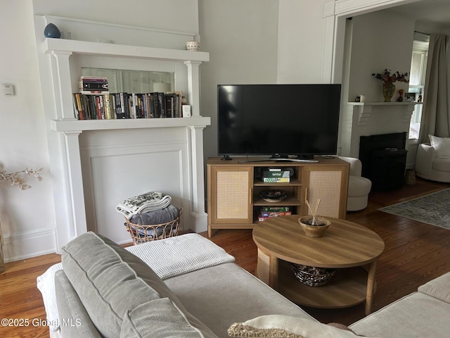 281 10th St, Troy, NY 12180 - living room with wood finished floors and a fireplace