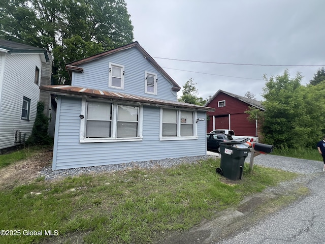 14 Lower Turnpike Rd, Granville, NY 12832 - view of front facade with a standing seam roof and metal roof