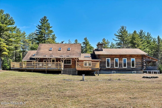 399 Loch Muller Rd, Schroon, NY 12870 - rear view of house featuring a lawn, a wooden deck, and log siding