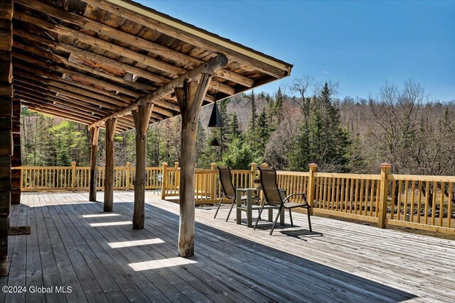 399 Loch Muller Rd, Schroon, NY 12870 - wooden terrace with a forest view