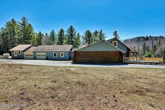 399 Loch Muller Rd, Schroon, NY 12870 - view of side of home with a yard, log siding, and a forest view