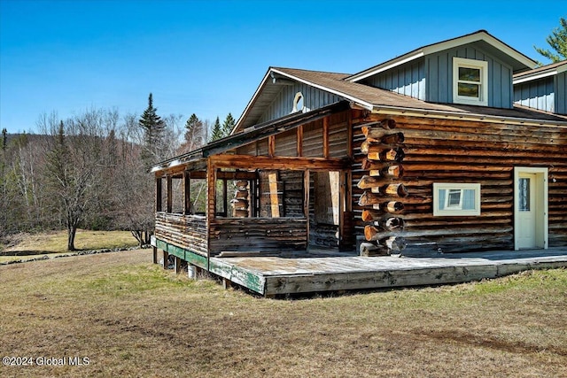 399 Loch Muller Rd, Schroon, NY 12870 - back of property featuring board and batten siding, a yard, and log exterior