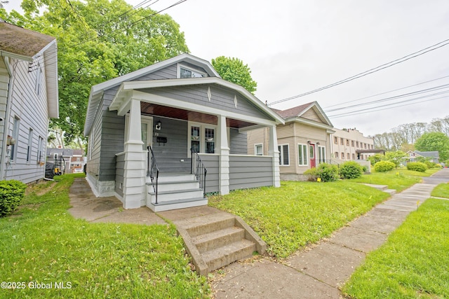 35 Wallace St, Scotia, NY 12302 - view of front of property with covered porch and a front yard