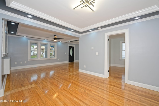 35 Wallace St, Scotia, NY 12302 - unfurnished living room with crown molding, a raised ceiling, light wood-type flooring, ceiling fan, and baseboards