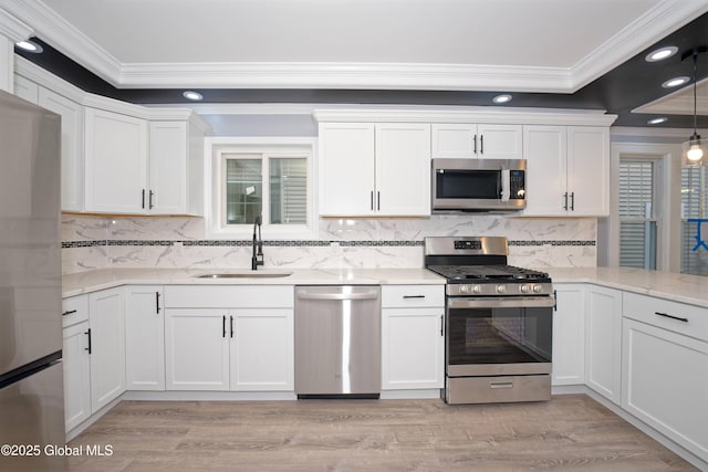 35 Wallace St, Scotia, NY 12302 - kitchen featuring appliances with stainless steel finishes, ornamental molding, a sink, white cabinetry, and recessed lighting