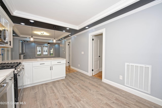 35 Wallace St, Scotia, NY 12302 - kitchen featuring ornamental molding, appliances with stainless steel finishes, light wood-style floors, and white cabinetry