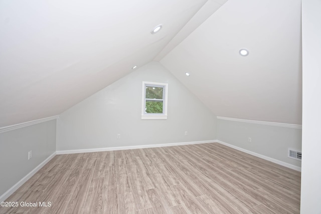 35 Wallace St, Scotia, NY 12302 - bonus room with light wood-style floors, baseboards, vaulted ceiling, and recessed lighting
