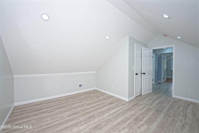 35 Wallace St, Scotia, NY 12302 - bonus room featuring vaulted ceiling, wood finished floors, baseboards, and recessed lighting