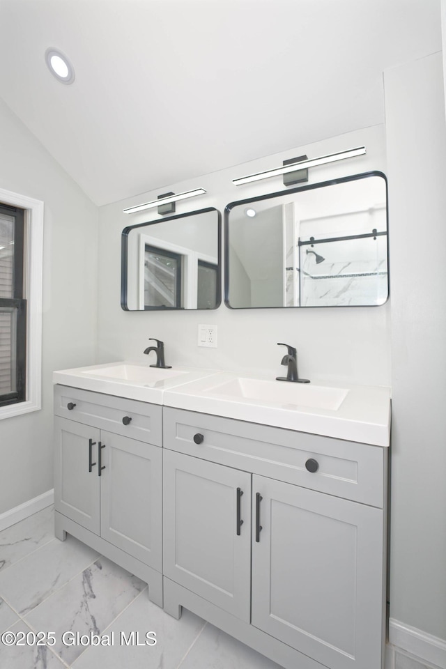 35 Wallace St, Scotia, NY 12302 - bathroom with double vanity, marble finish flooring, baseboards, and lofted ceiling