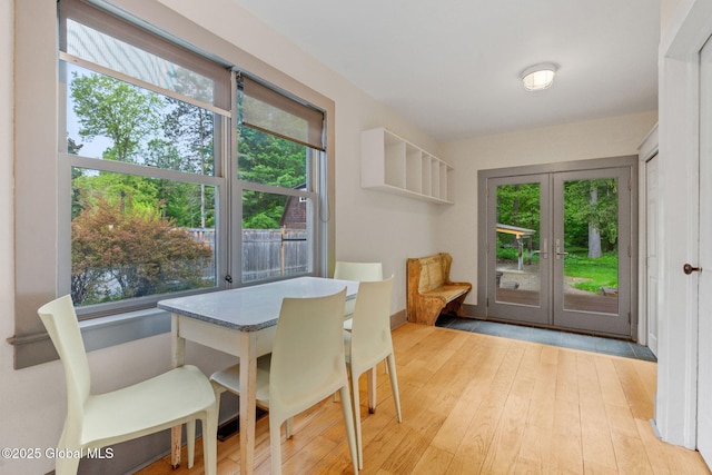 406 Northern Pines Rd, Wilton, NY 12831 - dining area featuring french doors, hardwood / wood-style flooring, and baseboards