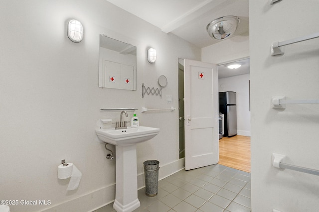 406 Northern Pines Rd, Wilton, NY 12831 - bathroom with tile patterned floors, a sink, and baseboards