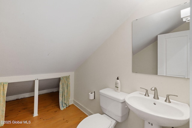 406 Northern Pines Rd, Wilton, NY 12831 - bathroom with a sink, wood finished floors, vaulted ceiling, toilet, and baseboards