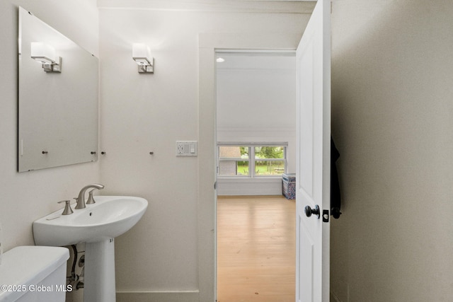 406 Northern Pines Rd, Wilton, NY 12831 - half bathroom featuring toilet and wood finished floors