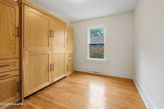 406 Northern Pines Rd, Wilton, NY 12831 - unfurnished bedroom featuring ornamental molding, light wood-style floors, and baseboards
