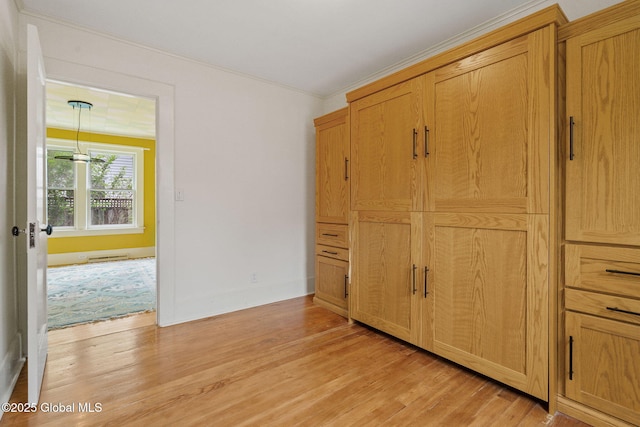 406 Northern Pines Rd, Wilton, NY 12831 - unfurnished bedroom featuring light wood-style floors and ornamental molding