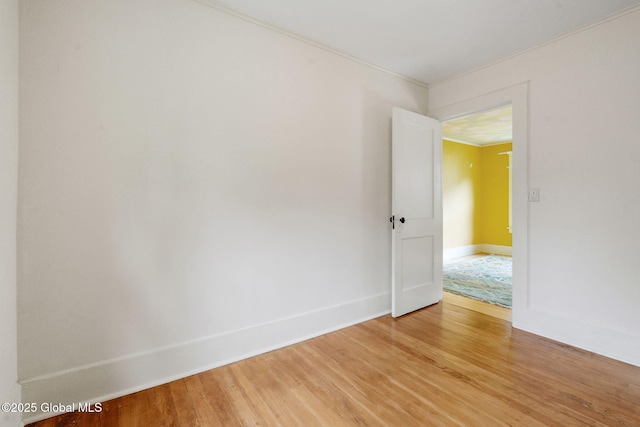 406 Northern Pines Rd, Wilton, NY 12831 - empty room with light wood-style floors, crown molding, and baseboards