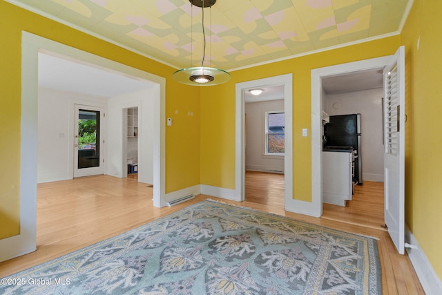 406 Northern Pines Rd, Wilton, NY 12831 - unfurnished dining area featuring light wood finished floors, crown molding, and baseboards